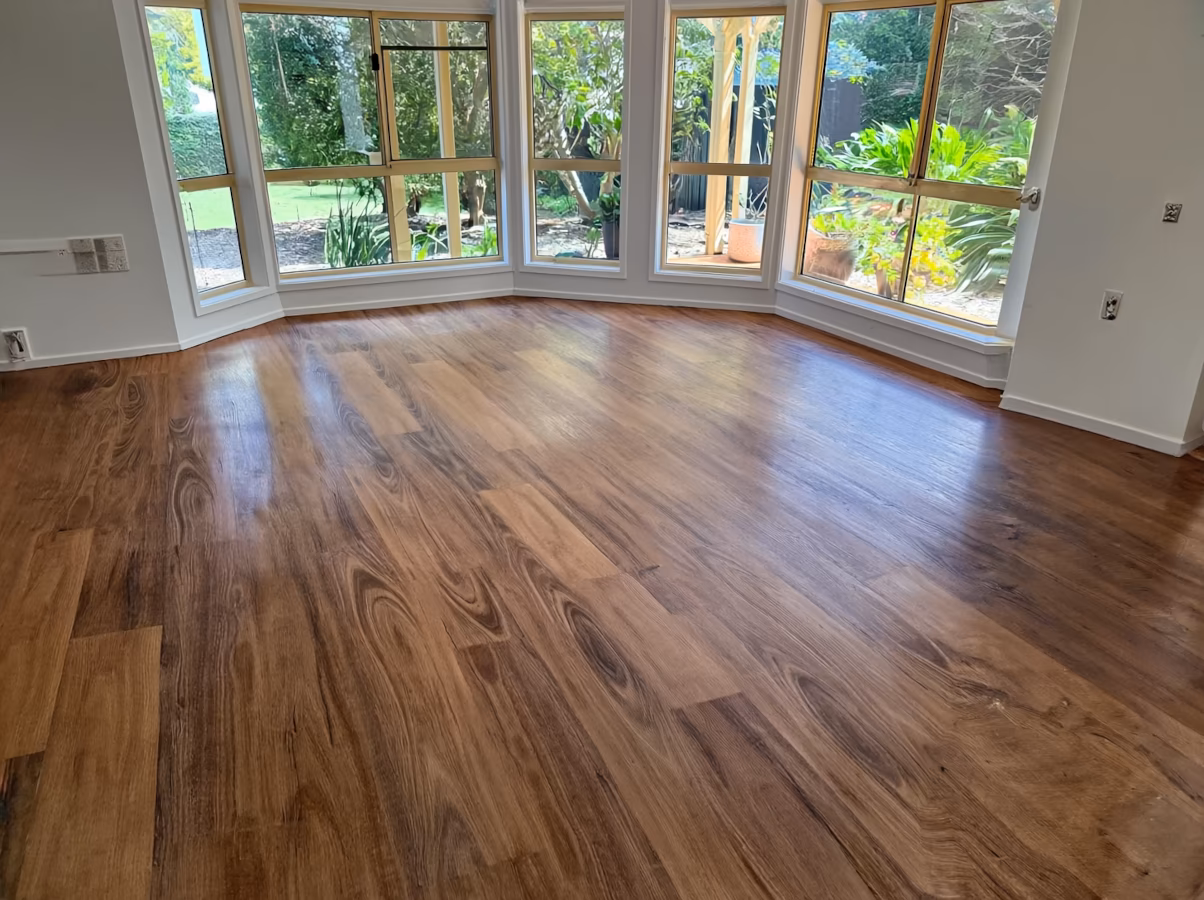 Vinyl plank flooring installation showing realistic wood appearance and luxury finish
